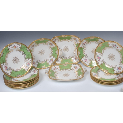 69 - An early 20th century Coalport dessert service, comprising twelve dessert plates, two shaped circula... 