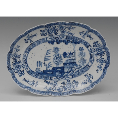 80 - A Derby shaped oval dish,  painted in underglaze blue with a Chinese Landscape within in cell border... 