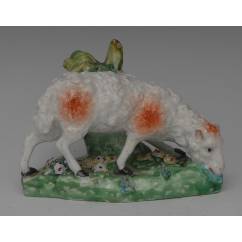 84 - A Derby Patch Mark model, sheep grazing, shaped base encrusted with foliage, 8.5cm high, c.1770