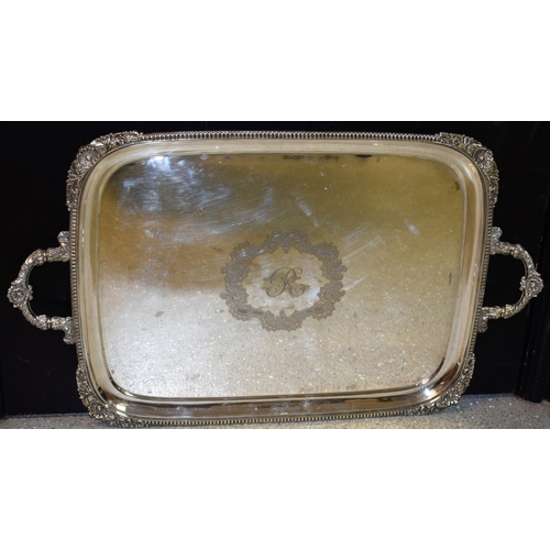 10 - A large Victorian E.P.N.S two-handled rounded rectangular serving tray, gadrooned border with scroll... 