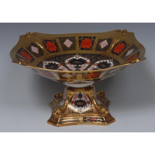 95 - A Royal Crown Derby 1128 pattern pedestal shaped square comport, in relief with dolphins to angles, ... 