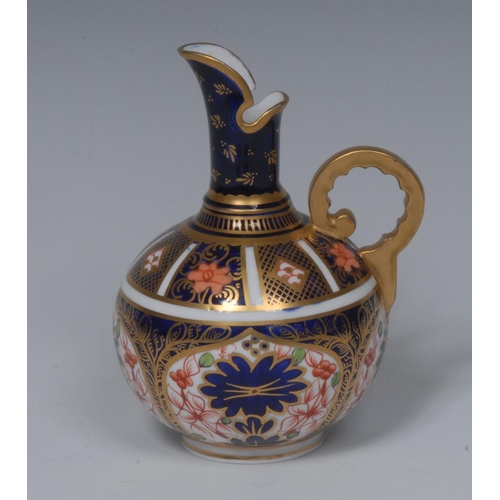 98 - A Royal Crown Derby 1128 pattern globular jug, gilt scroll, 12.5cm high, printed mark, date code for... 