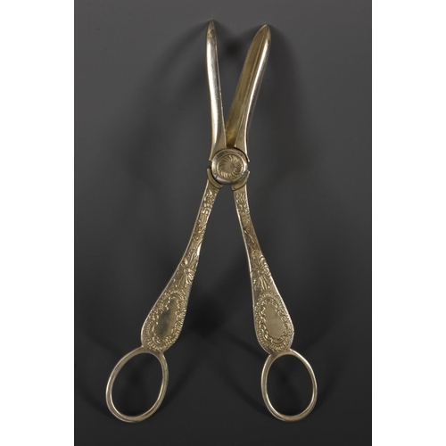 15 - A pair of Elizabeth II silver grape shears, bright-cut engraved with acanthus and flowering C-scroll... 