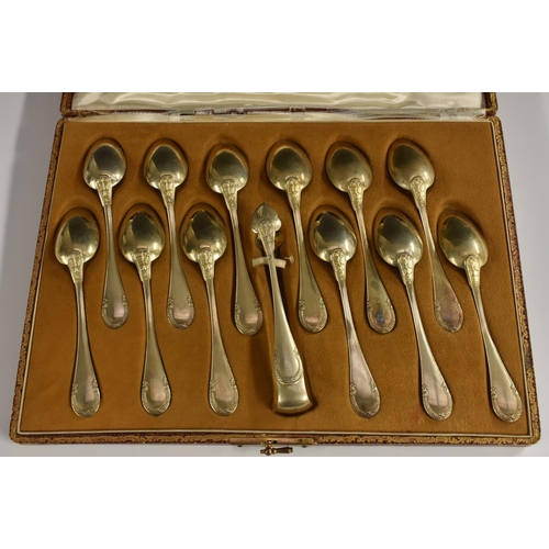 30 - A set of twelve French silver-gilt teaspoons, tongs ensuite, Emile Puiforcat, Paris, c.1900, cased