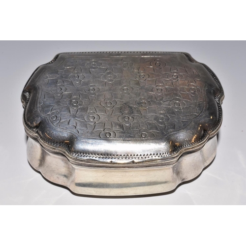 55 - A Continental silver shaped serpentine snuff box, hinged cover chased with rows of flowerheads, gilt... 