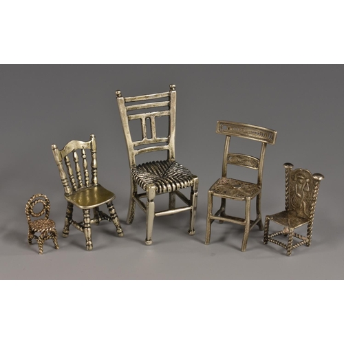 57 - A Continental silver toy miniature model, of a Victorian kitchen chair, 3.5cm high, import marks for... 