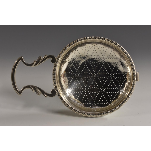 68 - A George II silver orange strainer, gadrooned rim, leafy lug handle, 16.5cm wide, Edward Aldridge I,... 