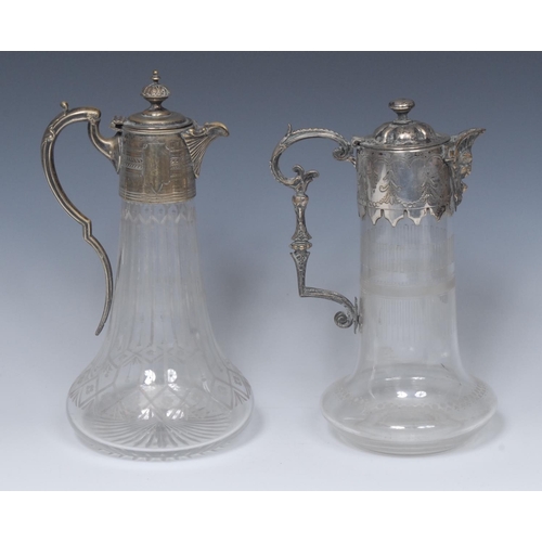 8 - A  Victorian clear glass and  E.P.N.S mounted claret jug, 28cm high, c.1890;  another, similar  (2)