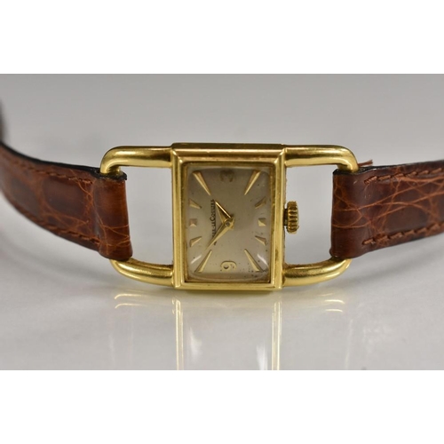 3060 - Jaeger Le Coultre - an unusual lady's 18ct gold wristwatch, rectangular silvered dial, arrow batons,... 