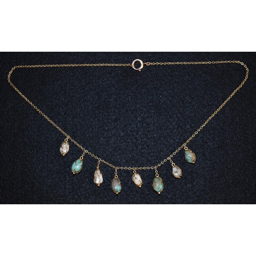 3152 - A turquoise and cultured pearl fringe necklace, alternate set with four wire wrapped turquoise and f... 