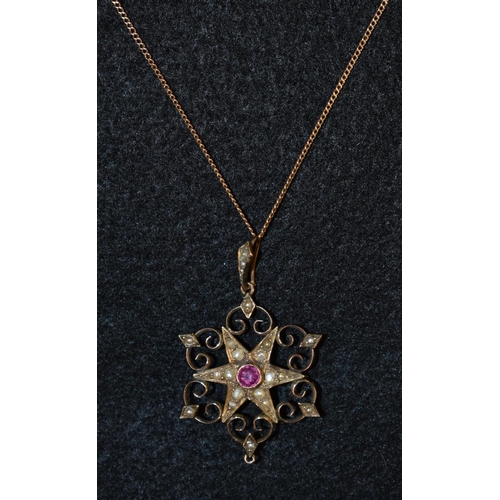 3169 - An Edwardian seed pearl and pale pink tourmaline star pendant necklace, central six point star withi... 