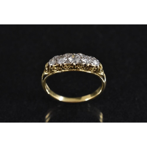 3176 - A diamond quintet line ring. set with five principle graduating old brilliant cut diamonds, each div... 