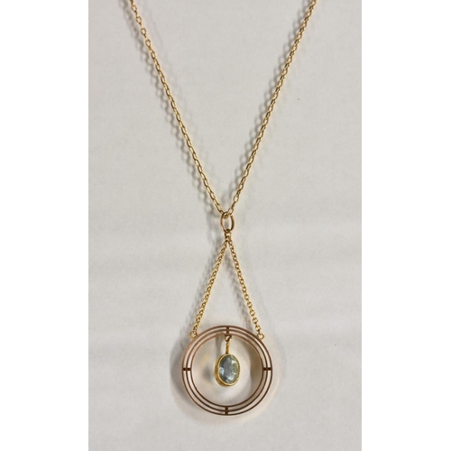 3192 - An Edwardian Topaz pendant, set with a single suspended faceted  pale blue topaz, within a triple co... 