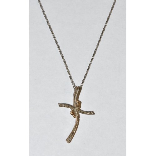 3198 - A diamond set curved cross pendant necklace, each arm inset with a diamond accent terminal, stamped ... 