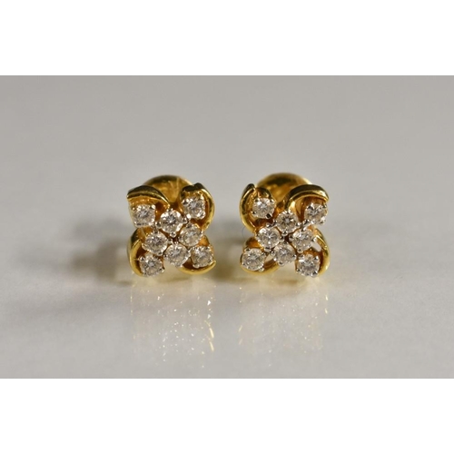 3209 - A pair of diamond eight stone cluster earrings, each with a central cluster of four round cut diamon... 