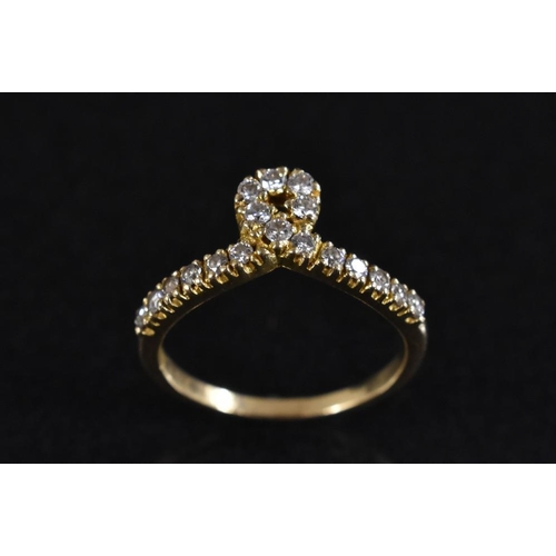 3210 - A diamond loop ring, single loop crest, linear set with eighteen round cut diamonds, total estimated... 