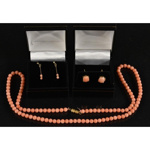 3221 - Coral -a single strand pink coral globular bead necklace, barrel clasp, 48cm long; a pair of similar... 