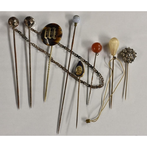 3233 - Hat and Scarf Pins - a 19th century tortoiseshell silver inlaid hat pin, letter M upon domed circula... 