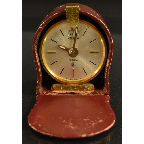 3376 - A Jaeger Recital 8 day travelling alarm clock, gilt metal case, textured effect, baton numerals, cas... 