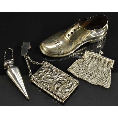 3377 - A silver pin cushion as a man's shoe, S Blanckensee & Son, Chester; a silver perfume bottle, flatten... 