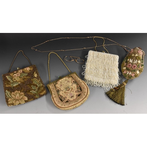 3393 - An embroidered purse, long chain strap, metallic thread tassel; a beaded evening purse; another simi... 