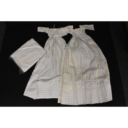 3432 - A late 19th Century cotton Christening robe, broiderie anglaise and lace trim; another similar; an E... 