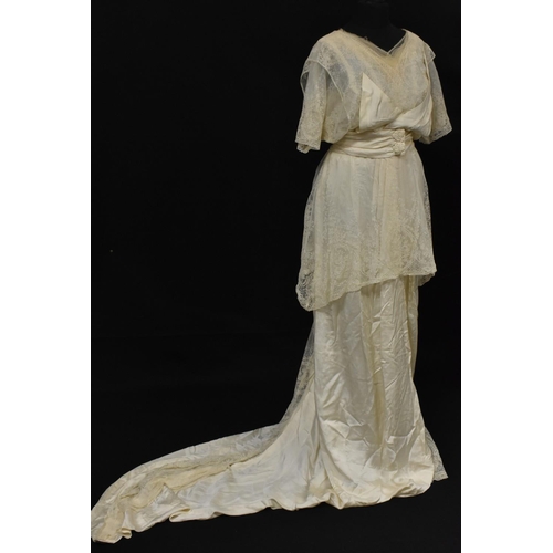 3433 - An Edwardian cream satin silk and lace wedding dress, crossover bodice, tapering train, belted waist