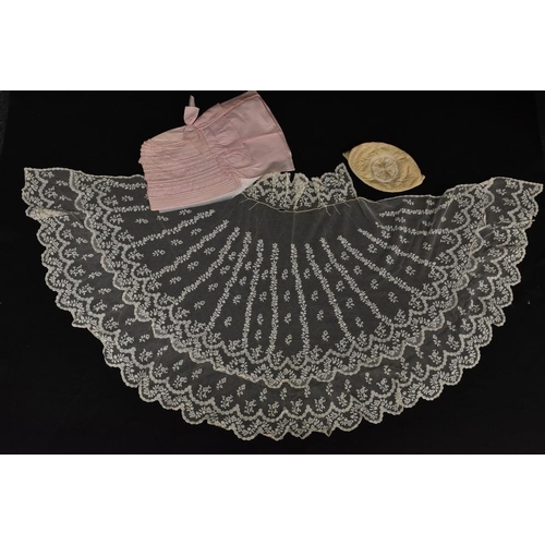 3451 - A late 19th Century pale pink cotton bonnet; a late 19th Century lace short cape; an embrodered silk... 