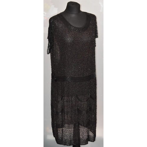 3471 - A 1920s Art Deco flapper style dress, black with beaded detail