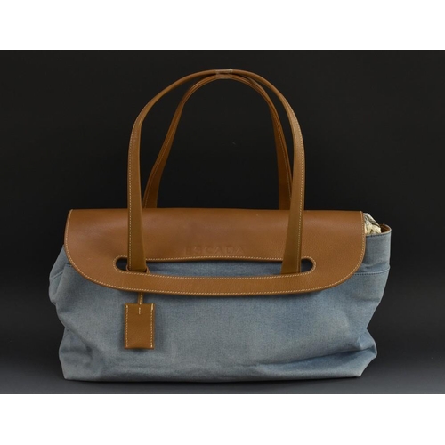 3480 - Handbags - an Escada bag, denim body, tan leather fold over flap, interior zippocket