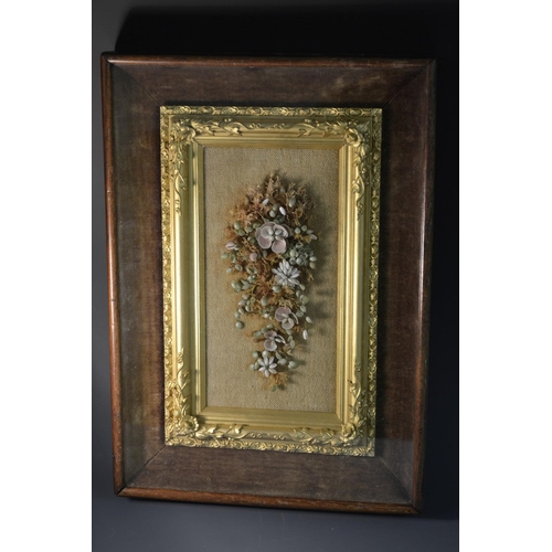 5058 - A 19th century seaweed and shell picture, arranged as a spray of flowers, gilt frame, glazed mahogan... 