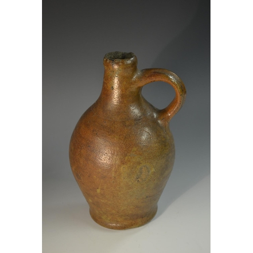 5071 - A brown salt glazed stoneware belamine, loop handle, 21cm high, 18th/19th century