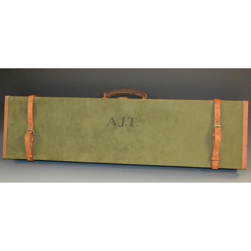 5072 - A canvas shotgun case, by Brady, Halesowen, hinged cover enclosing an arrangement of compartments, t... 