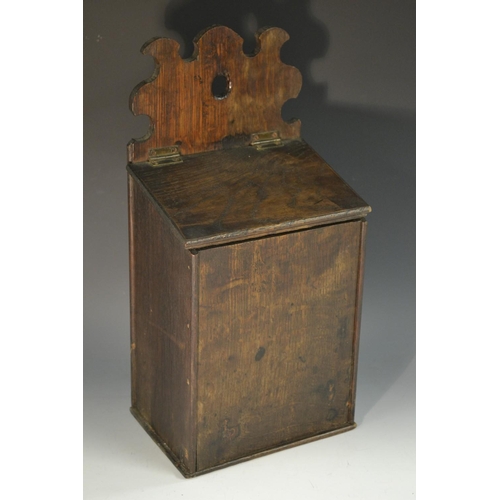 5095 - A George III oak rectangular candle box, shaped and pierced cresting, hinged sloping cover, 41cm hig... 