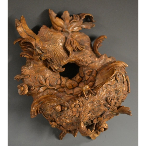 5115 - A late 19th century Black Forest birds nest wall pocket, carved with foliage, 15cm high, c.1880