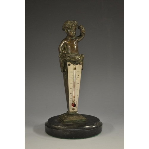 5116 - A late 19th century bronze desk thermometer, crested by a Bacchic infant, silvered scale, alcohol th... 