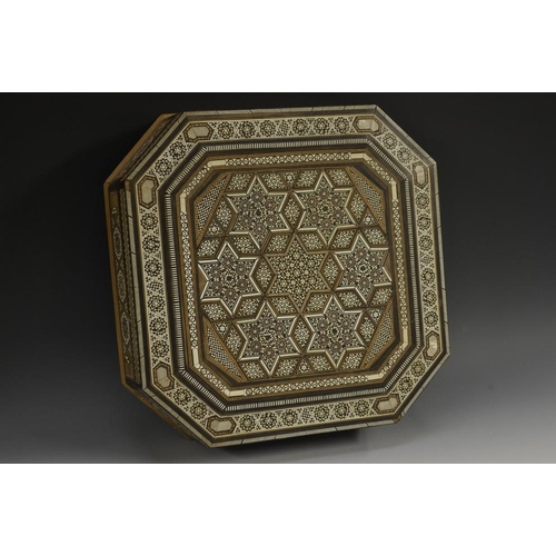 5133 - A Moorish marquetry canted square box, profusely inlaid with geometric motifs, hinged cover, 33.5cm ... 