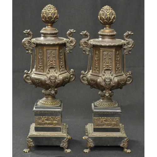 5142 - A pair of 19th century French dark patinated bronze urns, bud finials, dragon-capped handles, cast i... 