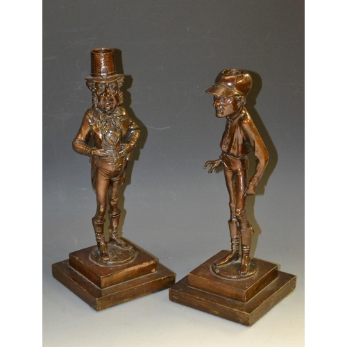 5144 - A pair of 19th century novelty and comic patinated candlesticks, as Fred Archer, the horse racing jo... 