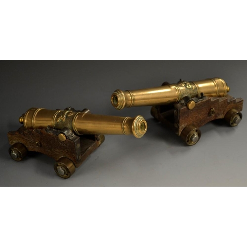 5153 - A pair of early 20th century bronze model desk cannons, 17.5cm barrels cast with crowned GR cyphers,... 