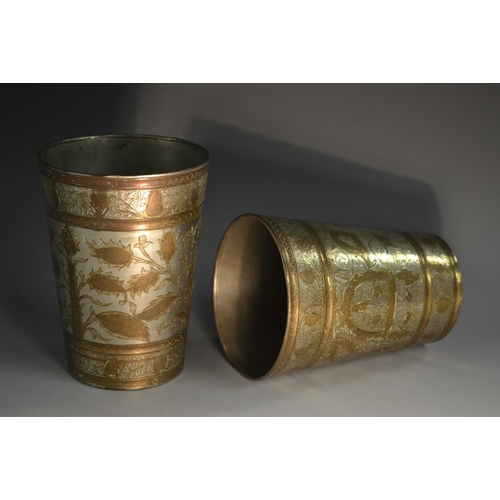 5158 - A pair of Indo-Persian tapered cylindrical beakers, damascened and chased with stylised leaves and s... 