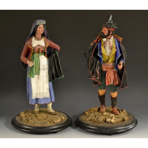 5160 - A pair of Italian papier-mâché proceppio-type figures, of a Tyrolean peasant and his wife, colourful... 