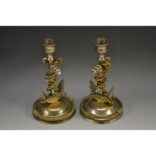 5162 - A pair of late 19th century gilt and silvered novelty candlesticks, as ships' anchors, domed bases w... 