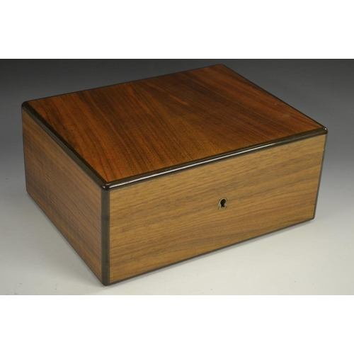 5168 - A rectangular gentleman's amboyna cigar humidor, by Dunhill, hinged cover enclosing a hygrometer, th... 