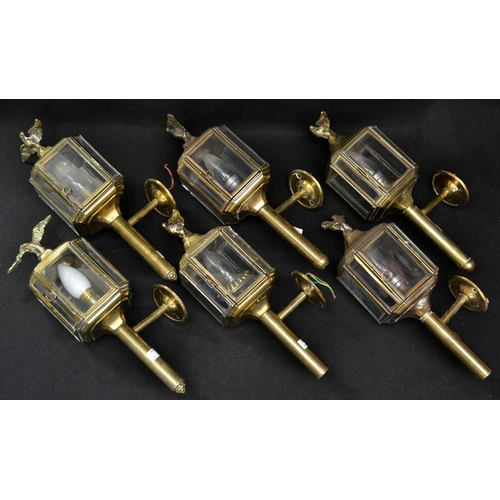 5179 - A set of six early 20th century brass carriage wall lights, eagle finials, 38cm high, fitted for ele... 