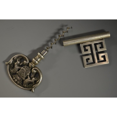 5180 - A silver-plated novelty travelling corkscrew, as a key, the handle with a coat of arms, 13cm long