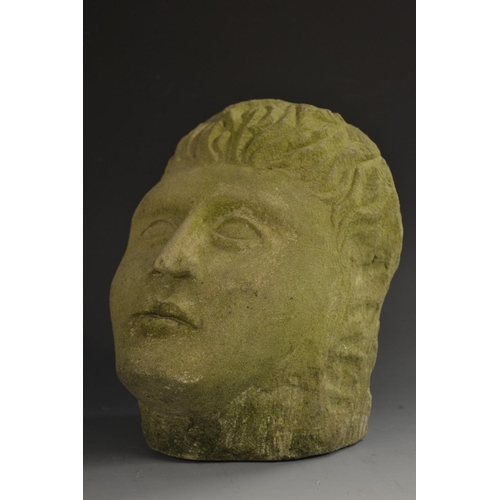 5181 - A stone head, carved hair and features, 21cm high, 19th century