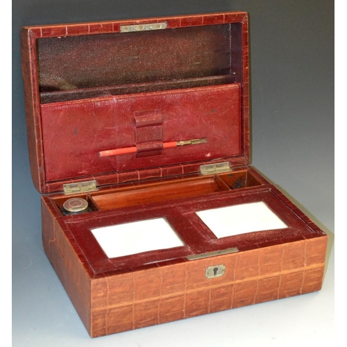 5187 - A Victorian crocodile skin rectangular writing and correspondence box, hinged domed cover enclosing ... 