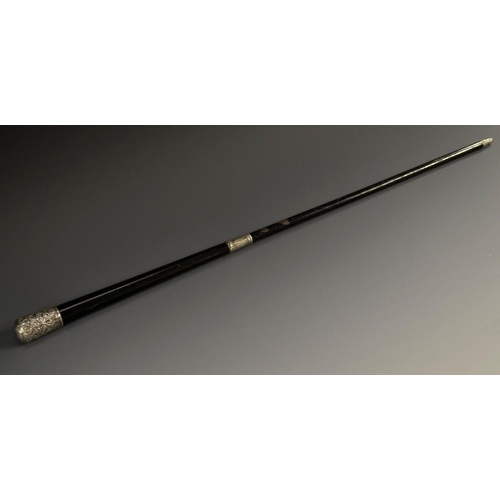 5204 - A Victorian silver mounted ebonised conductor's baton, the pommel and ferule embossed with scrolling... 