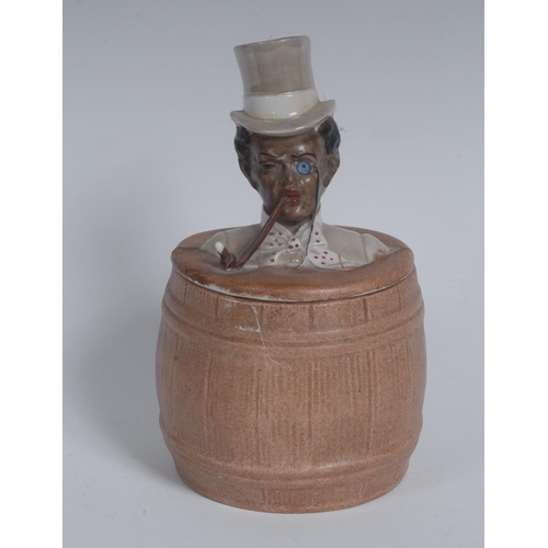 3028 - An early 20th century Continental bisque porcelain novelty tobacco jar, as a black gentleman, emergi... 